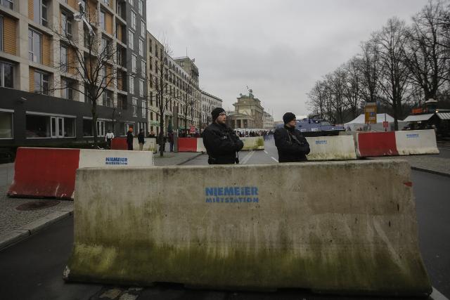 Armed police stand behind concrete blocks near the Brandenburg Gate in Berlin on Dec. 23 (Tanjug/AP)